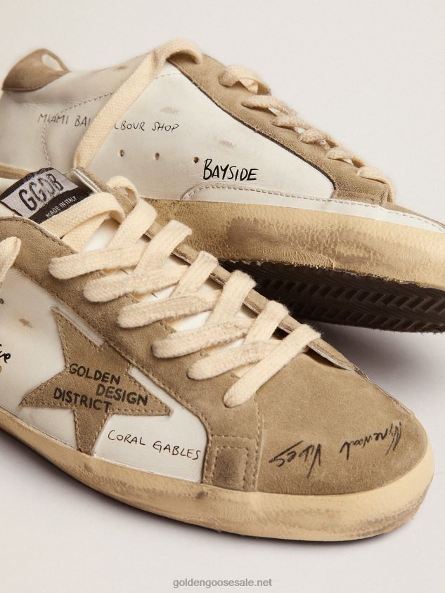 Super-Star sneakers in white leather with dove-gray suede inserts and all-over black lettering FN20N511 Men Golden Goose